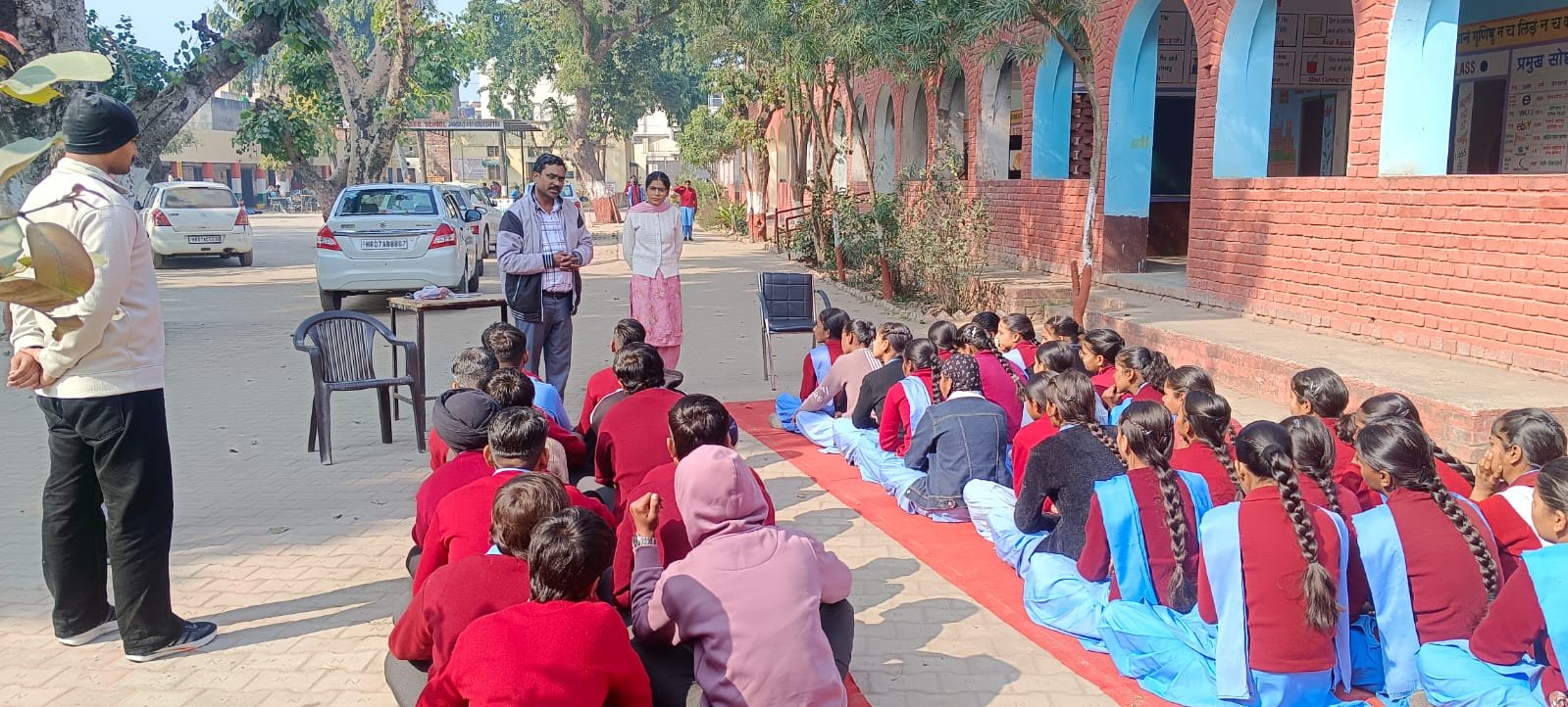 Students with career guidance materials in a school courtyard